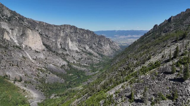 Bitterroot Mountains and rugged canyon landscape with distant valley view in western Montana 4K aerial drone video
