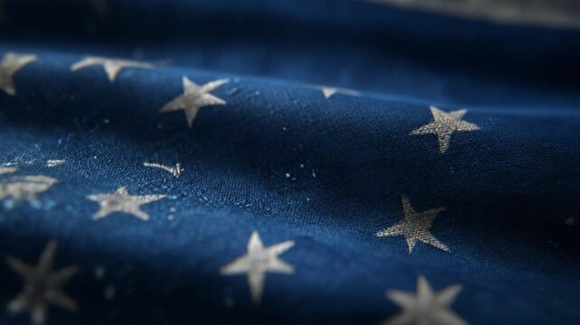Close-up of a blue fabric with a pattern of stars, evoking a sense of patriotism
