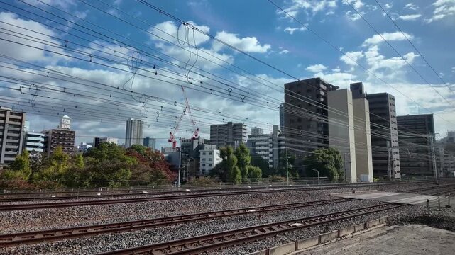 local Japanese Train Stopped at Platform on Clear Day