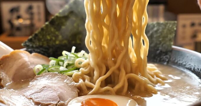 Delicious ramen noodles being lifted.