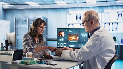 Health expert does oxygen saturation measurement in the cabinet, checking vital signs during routine checkup with patient. Physician using an oximeter for accurate consultation readings. Camera A.