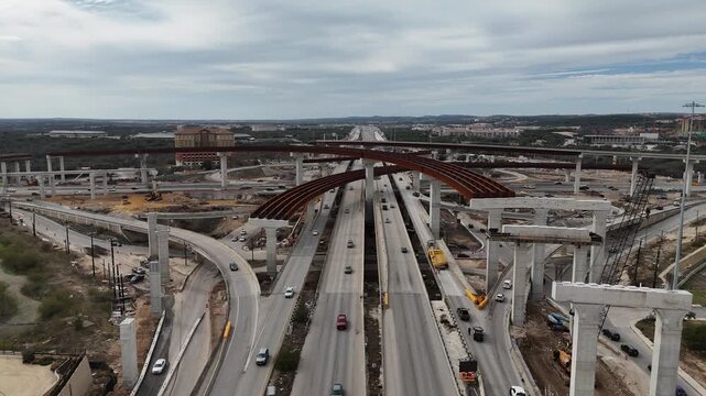 view of Interstate 10 and Loop 1604 highway interchange under construction in San Antonio, Texas 4K Aerial Drone Video