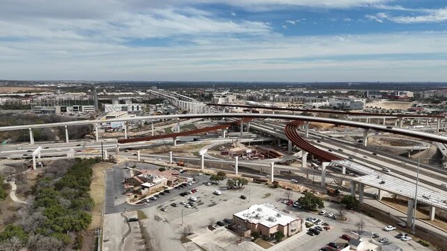 Interstate 10 and Loop 1604 interchange and highway under construction in San Antonio, Texas 4K Aerial Drone Video

