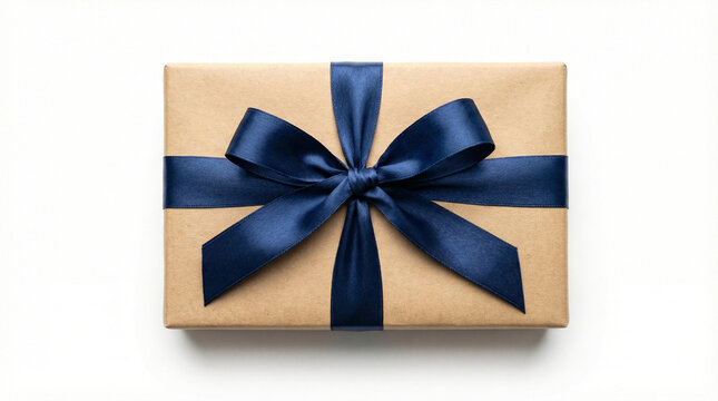 Top view of a brown kraft paper gift box tied with a dark blue ribbon. Minimalist wrapped present on white background. Copy space for text