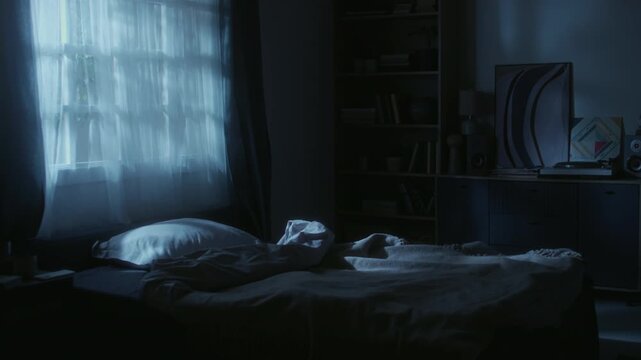 Establishing shot of unmade empty bed illuminated by moonlight standing in bedroom during late night, copy space