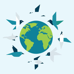 Earth globe surrounded by flying birds