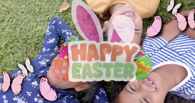 Vertical video: Three girls lying on lawn, starting HAPPY EASTER overlay with butterflies for ads