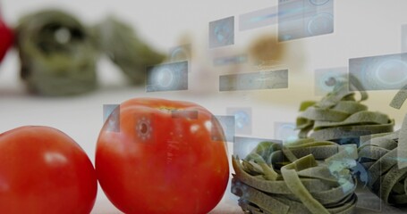 Displaying two red tomatoes with green pasta nests on white tabletop, showing holographic UI panels
