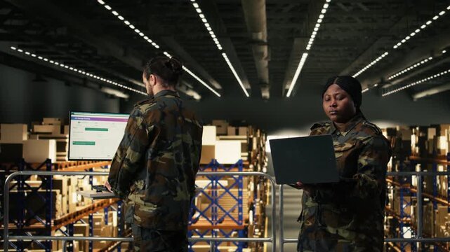 Female military personnel overseeing mission logistics for e-commerce operations in distribution hub, cargo transportation and shipment tracking. Soldier in uniform manages supply chain process.