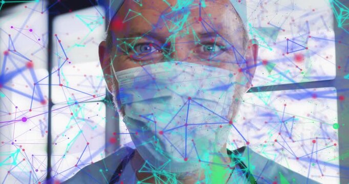 Male doctor facing lens while camera pulling, exposing face as nodes flowing, showing medical data