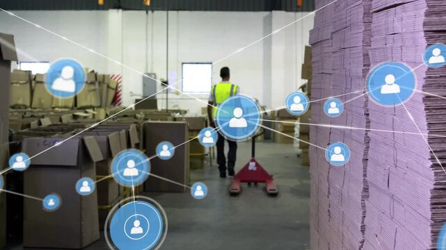 Warehouse worker walking aisle pushing red pallet-jack emitting blue nodes forming asset network