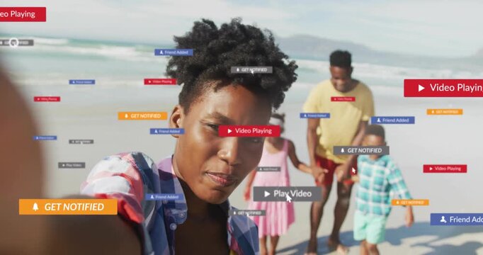 Woman starting phone selfie on beach, recording family while notify tags growing over faces for ads