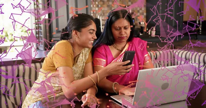 Mom-daughter duo at table, left showing phone causing laptop IT focus, laughing under poly overlay