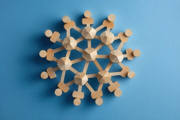 Obraz premium Geometric Snowflake on Blue: A meticulously crafted geometric snowflake sits gracefully against a serene blue backdrop, creating a visual symphony of precise angles and delicate form.