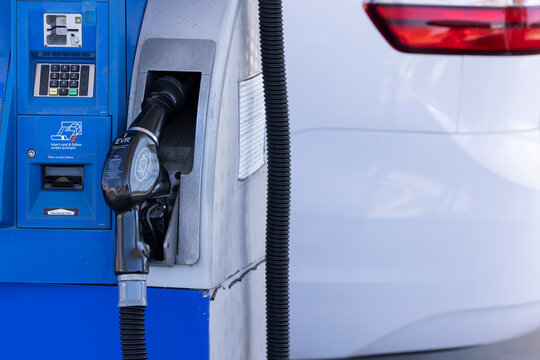 Yorba Linda, California, USA - March 12, 2026: A nozzle docks with a gasoline fuel pumping station.