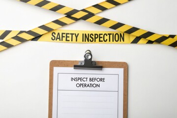 Obraz premium Safety Inspection Sign with Clipboard and Caution Tape