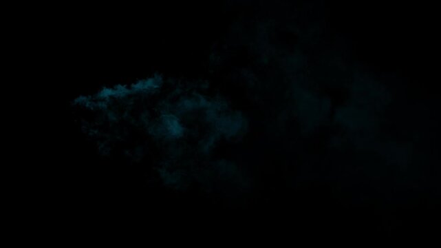 Cyan smoke puff cloud floating and dissolving on black background for vfx compositing