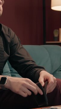 Drunk depressed Caucasian male gambler open empty wallet losing poker bet home poor man guy sad player lost money wager betting playing drinking alcohol whiskey smoking cigar gambling failure casino