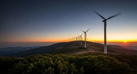 Obraz premium Renewable Energy Wind Turbines On A Grassy Hilltop At Sunset