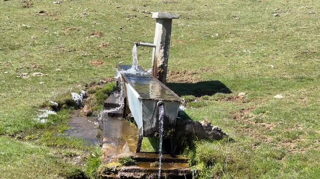 Rustic Mountain Fountain in Rocky Landscape