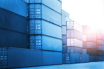 Fototapeta premium Row of Stacked Shipping Cargo Containers. Container Yard. Logistics Transportation Industry. Cargo Container ships, Global Business Shipping Import-Export. Warehouse Port. Logistics Transport.