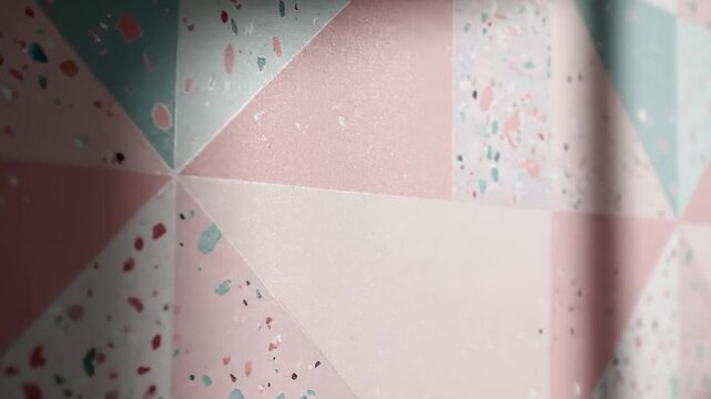 Close-Up of a Pink and Teal Terrazzo Patterned Wall With Geometric Designs