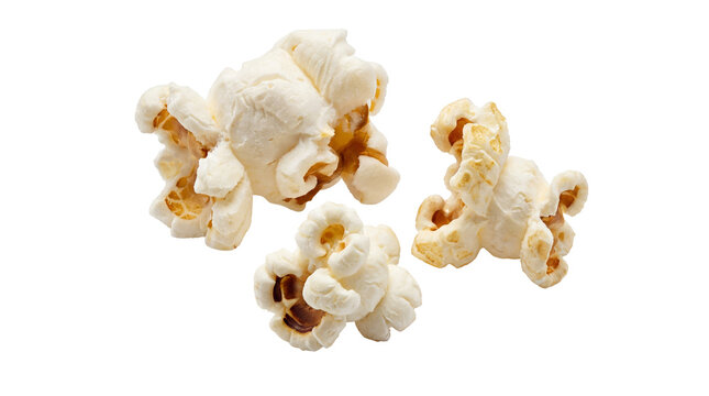 Freshly popped, fluffy popcorn kernels captured dynamically, isolated on a transparent background for versatile design.