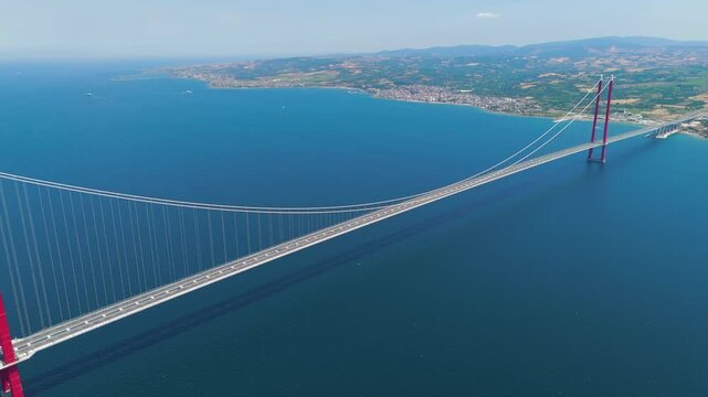 Lapseki, Turkey. Wide aerial view of 1915 Canakkale Bridge with moving cars, the town of Lapseki and the Dardanelles waters. Aerial View