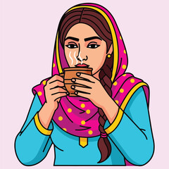 Young south asian woman in traditional dupatta drinking hot tea from clay cup