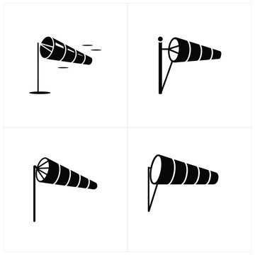 Four black and white wind direction indicators in different positions