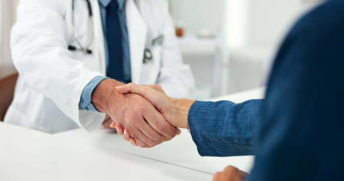 Healthcare, doctor or patient with handshake in office, thank you or greeting for checkup appointment. Gratitude, introduction or people shake hands for medical support, health consultation or clinic