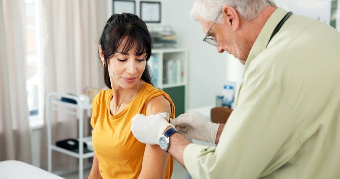 Vaccine, patient and doctor with plaster in office, medical appointment and flu immunization for health. Wound protection, mature woman and man with illness prevention shot, healthcare and hospital