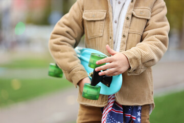 Cute little boy with skateboard in park © Pixel-Shot