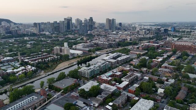 Aerial drone view of Turcot Interchange, Lachine Canal and baseball field at dusk in Montreal, Quebec, Canada. g.