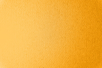 Fototapeta premium Warm fresh real yellow tone color paint on blank eco paper texture background with space minimal style