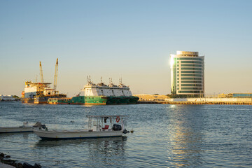 Fototapeta premium Ras al Khaimah emirate viewin the northern United Arab Emirates cityscape landmark and skyline view above the mangrove and corniche downtown area at dawn