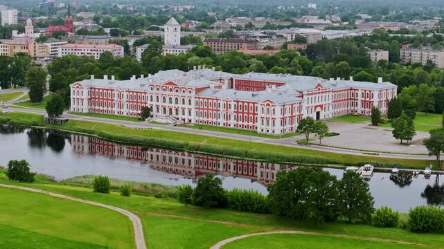 Jelgava Palace reflected in Lielupe River Jelgava Latvia cloudy summer day