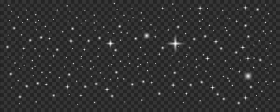 A dark background displays a dense scattering of bright white sparkling stars and glittering light effects