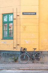 Fototapeta premium Bicycle Parked Against Yellow Building, Christianshavn, Copenhagen
