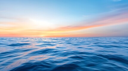 Fototapeta premium Serene Ocean View at Sunrise with Calm Waves and Colorful Sky Reflections