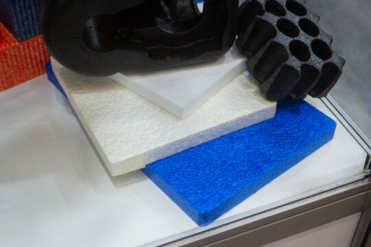 Products made from foamed polymers expanded polypropylene EPP and expanded polystyrene EPS. Model of dense and lightweight material, universal foam. New modern technologies. Industrial manufacturing