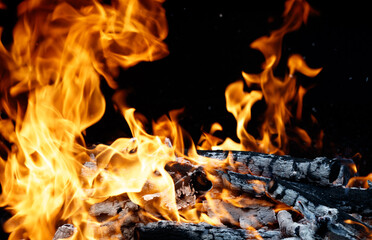 Fototapeta premium A pile of wood with a lot of fire on it