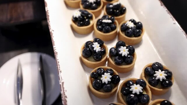 Dessert tart with berries on a restaurant buffet