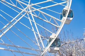 Winter Ferris Wheel Against Blue Sky
