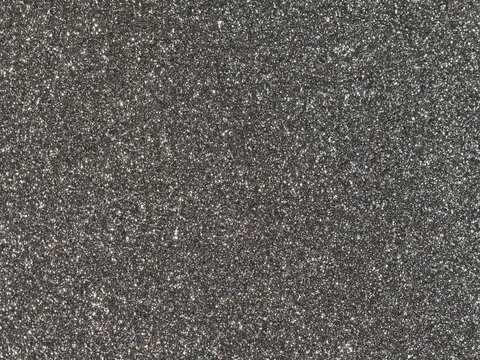 Macro shot of gunmetal grey metallic car paint texture