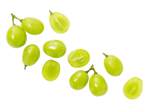 Scattered fresh Shine Muscat green grapes with halves isolated on transparent background