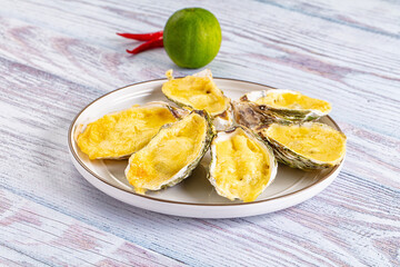 Baked oyster with parmesan cheese
