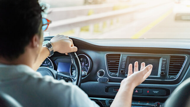 Driving a taxi in Dubai while discussing a route and picking up passengers