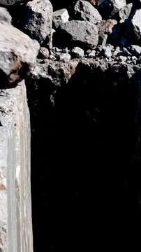 A heavy rock falls into a deep dark pit