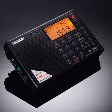 Krasnodar City, Russia - 5 March 2026: Tecsun PL-310ET radio on black glossy background